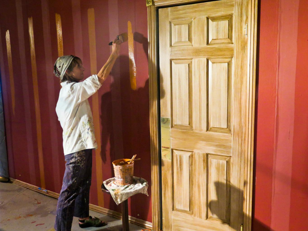 Benicia Theatre Group volunteers painting scenery flats before opening night